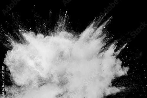 Fototapeta Naklejka Na Ścianę i Meble -  Abstract white powder explosion.White dust debris on black background.