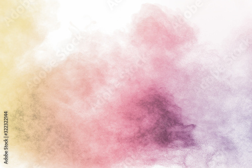 Colorful background of pastel powder explosion.Multi colored dust splash on white background.Painted Holi. © Pattadis