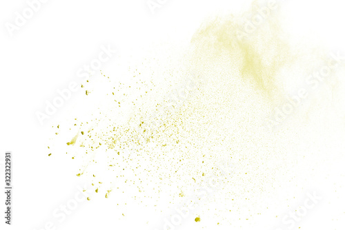 Yellow powder explosion on white background. Colored cloud. Colorful dust explode. Paint Holi.