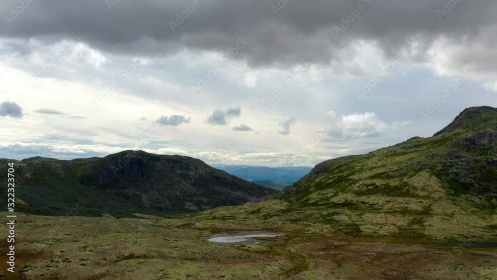 Drone Shot of the Scenic Norwegian Mountain Ranges Under Cloudy Skies Drone Shot of the Scenic Norwegian Mountain Ranges Under Cloudy Skies