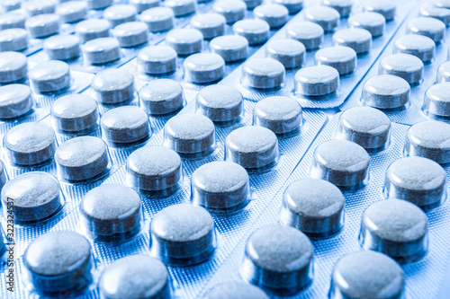 Fotografie A row of medicine pills close-up in blister packs