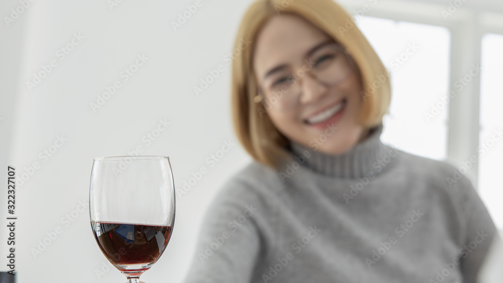 business women with red wine glasses in hand business women with red wine glasses in hand
