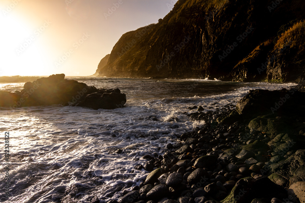 sunset on the black stone coast, Azores Island