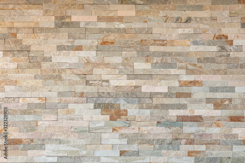 Stone wall pattern, decorative background texture. Light brown brick wall background for interior or exterior brick wall building and brick decoration texture.