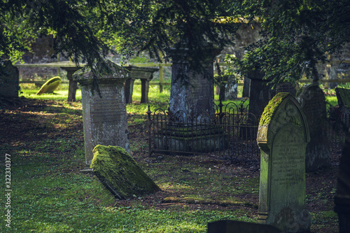 The summer view of cemetery with old gravestones in Scotland