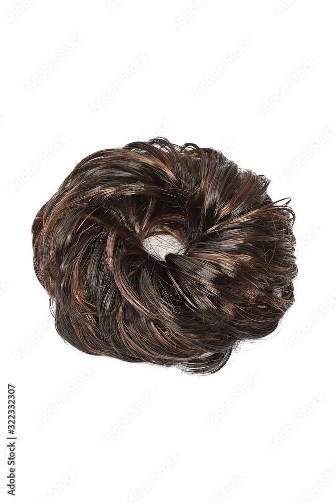 Subject shot of a fancy hair band made as a lustrous brown hair bun. The chignon scrunchie is isolated on the white background. Subject shot of a fancy hair band made as a lustrous brown hair bun. The chignon scrunchie is isolated on the white background.