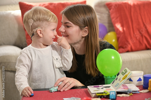 A Boy With A Hearing Aids And Cochlear Implants