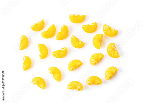 uncooked macaroni on a white background.