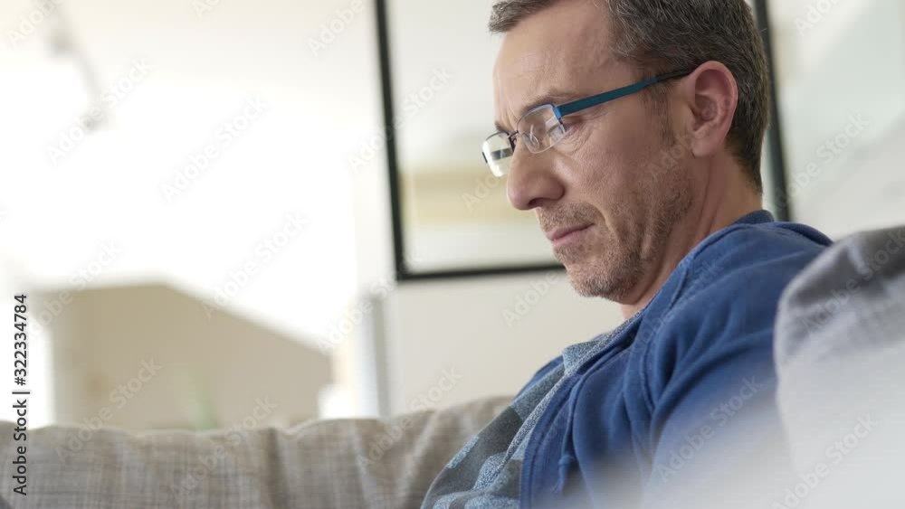 Portrait of middle-aged man connected on digital tablet Portrait of middle-aged man connected on digital tablet