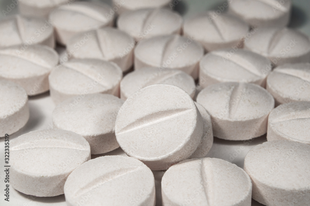 White medical pills and tablets with bottle White medical pills and tablets with bottle