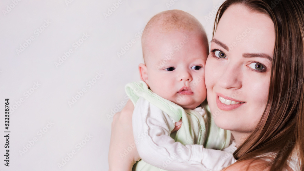 girl holds the baby in her arms. Close-up girl holds the baby in her arms. Close-up