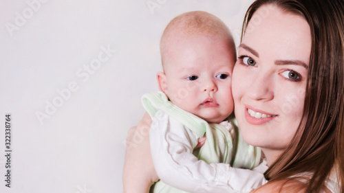 girl holds the baby in her arms. Close-up