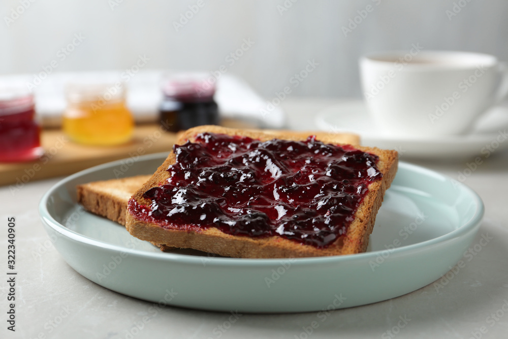 Delicious crispy toasts with jam on table Delicious crispy toasts with jam on table