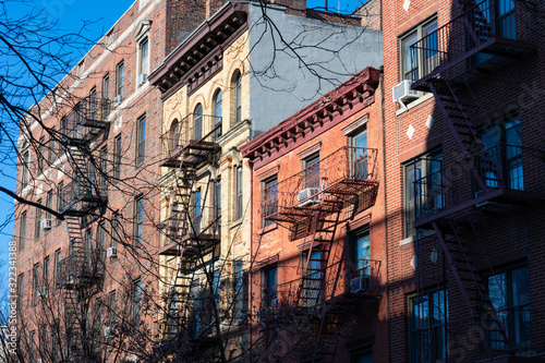 Colorful Old Buildings in Greenwich Village New York with Fire Escapes	