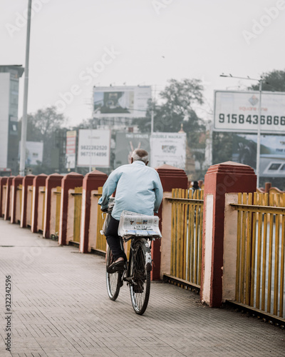 man riding a bike photo