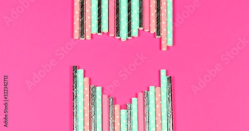 Stop motion animation of disposable paper tubes for cocktails. Ecology and nature protection concept.