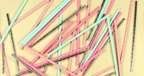 Stop motion animation of disposable paper tubes for cocktails. Ecology and nature protection concept.