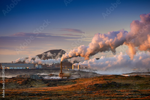 Alternative green energy. Geothermal power station pipeline and steam. Plant located at Reykjanes peninsula in Iceland, Europe.  Popular tourist attraction. Steaming hot water. Gunnuhver Hot Springs.