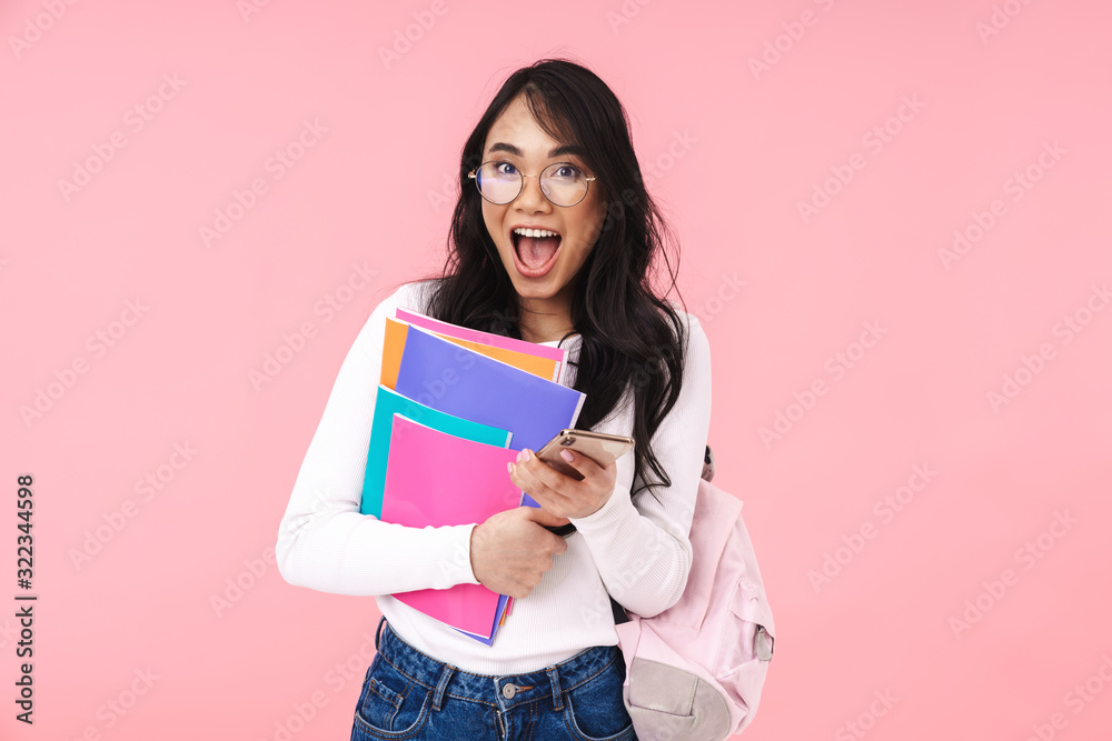 Image of young asian student girl wearing eyeglasses holding folders Image of young asian student girl wearing eyeglasses holding folders