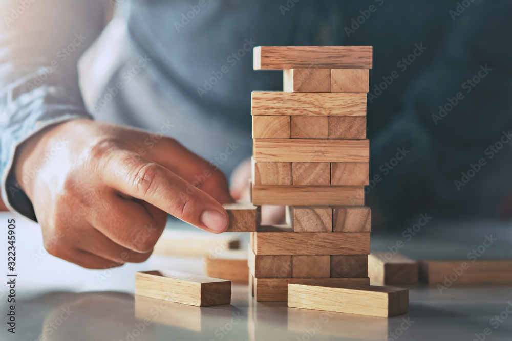 close up of hand businessman playing block wood close up of hand businessman playing block wood