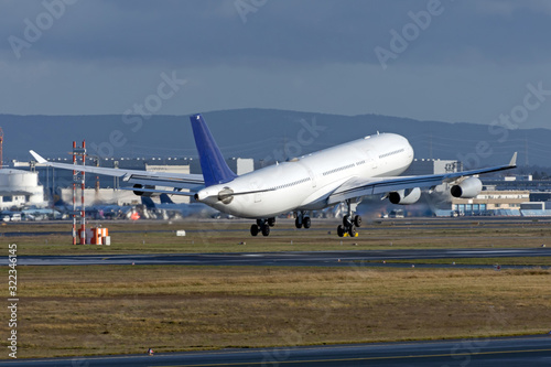 Airplane landing before gear touching the runway.