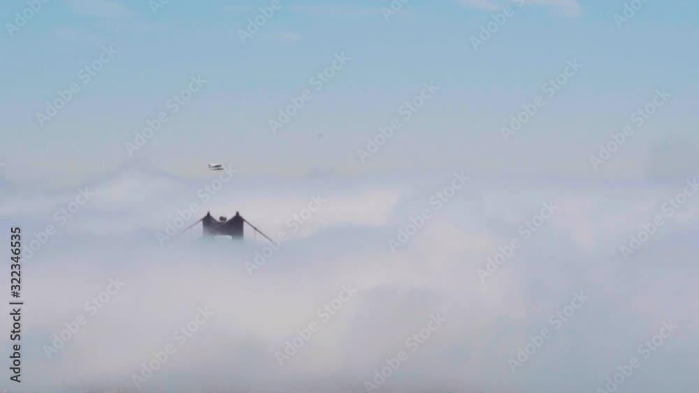Cessna Seaplane flying over the Golden Gate bridge shrouded in fog on a summer day. Shot in 120fps exported at 24fps. Cessna Seaplane flying over the Golden Gate bridge shrouded in fog on a summer day. Shot in 120fps exported at 24fps.