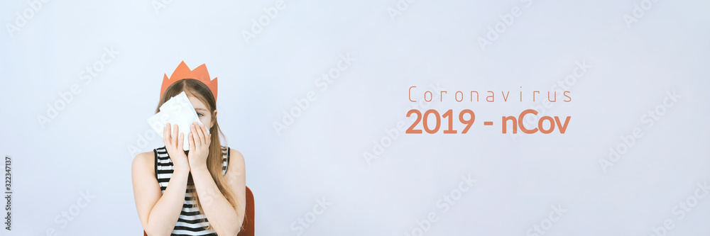 Coronavirus 2019 n-Cov concept with text. Girl with red crown and white handkerchief. Sars virus. Grey background. Stock photo banner. Coronavirus 2019 n-Cov concept with text. Girl with red crown and white handkerchief. Sars virus. Grey background. Stock photo banner.