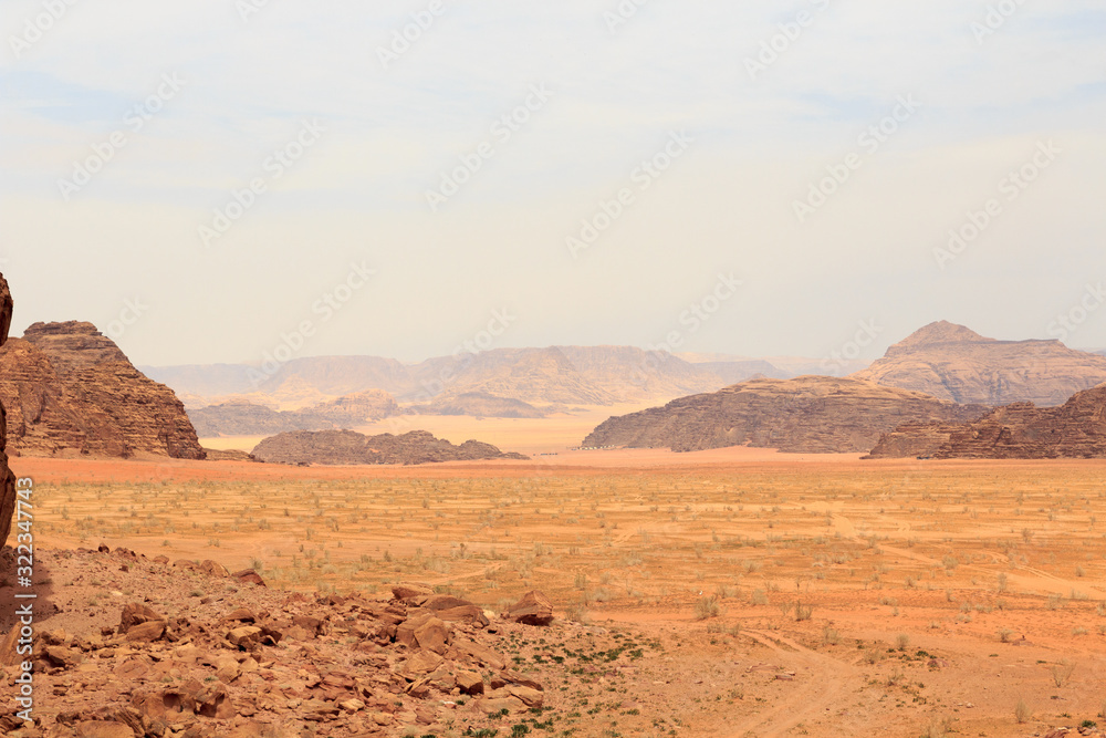 Wadi Rum desert panorama with dunes, mountains and sand, Jordan Wadi Rum desert panorama with dunes, mountains and sand, Jordan