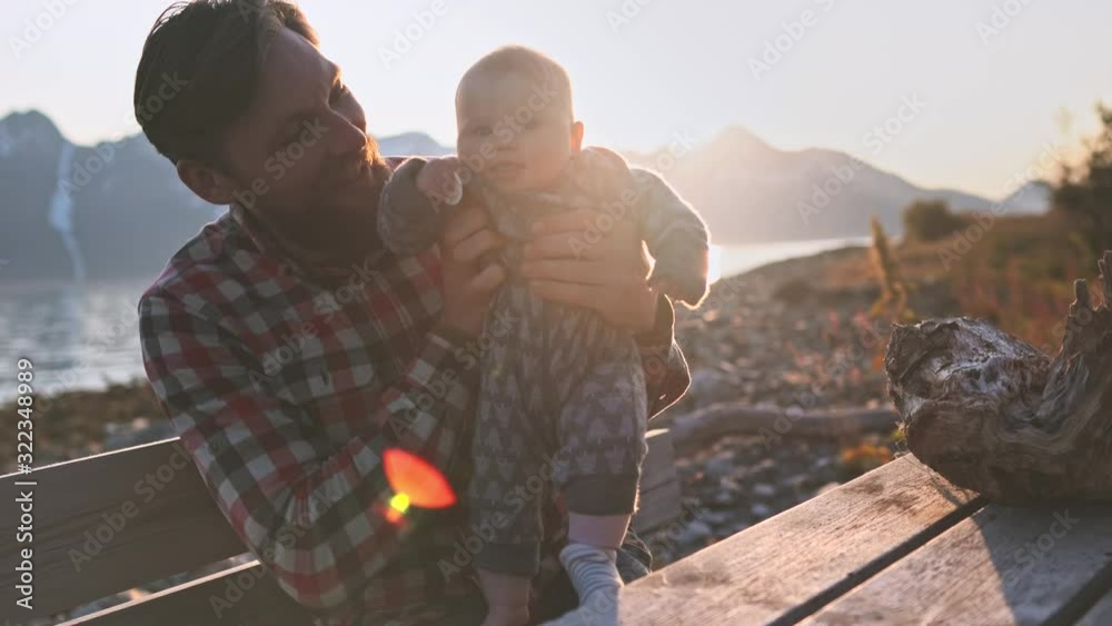 Father and child playing outdoor in Norway family vacations dad and baby daughter together parents childhood lifestyle mountains and fjord landscape Father and child playing outdoor in Norway family vacations dad and baby daughter together parents childhood lifestyle mountains and fjord landscape