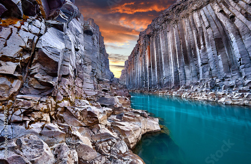 Studlagil basalt canyon, Jokulsa a Dal River. Iceland, Europe. One of the most wonderfull hidden place and nature sightseeing. Famous tourist landscape with basalt rock formations. Travel postcard.