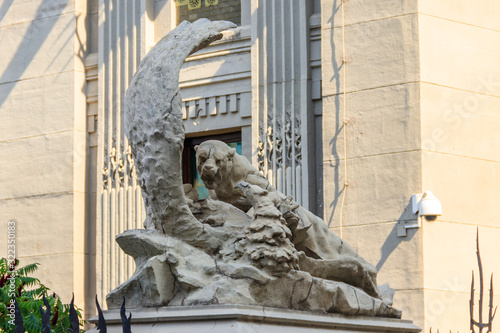 Statue of fight a lioness with eagle near House with Chimaeras in Kiev, Ukraine photo