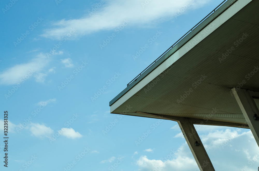 People relax by the sea. Friends are sitting on the pier.