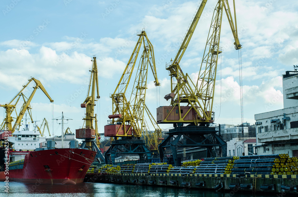 Sea port. Ships are in the port. Port cranes.