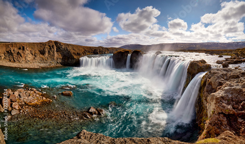 Panorama of most famous place of Golden Ring Of Iceland. Godafoss waterfall near Akureyri in the Icelandic highlands, Europe. Popular tourist attraction. Travelling concept background. Postcard. © zicksvift
