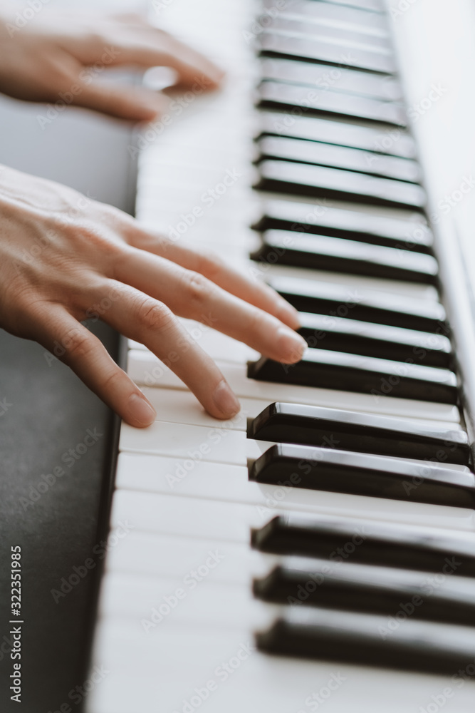 Hands of musician. Pianist playing on a midi keyboard indoor Hands of musician. Pianist playing on a midi keyboard indoor