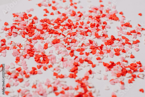 Many multicolored sugar hearts on a white background. Valentine's day concept.