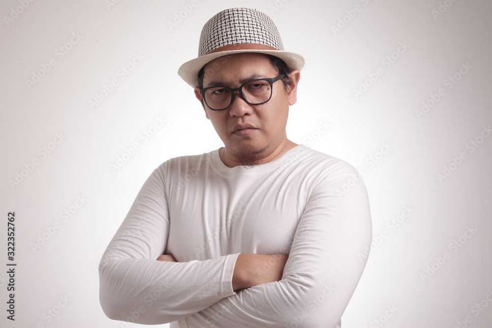 Young Man Staring at Camera with Suspicious Cynical Expression Young Man Staring at Camera with Suspicious Cynical Expression