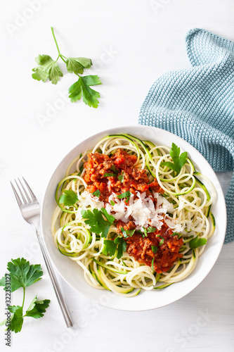 keto paleo zoodles bolognese: zucchini noodles with meat sauce and parmesan photo