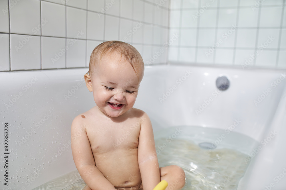 Baby smiling in bath Baby smiling in bath