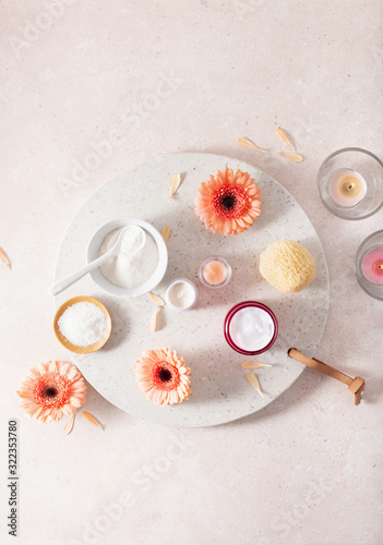 skincare products and daisy flowers. natural cosmetics for home spa treatment