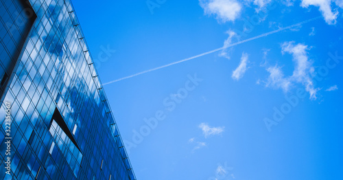 skyscraper with blue sky and clouds