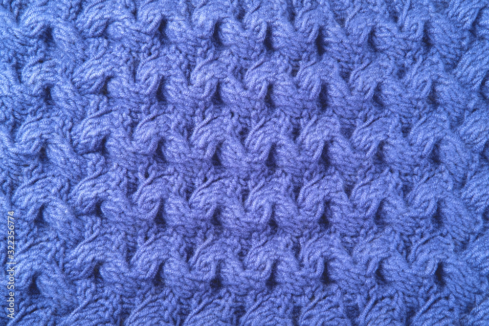 Beautiful wool knitted background in blue color.
