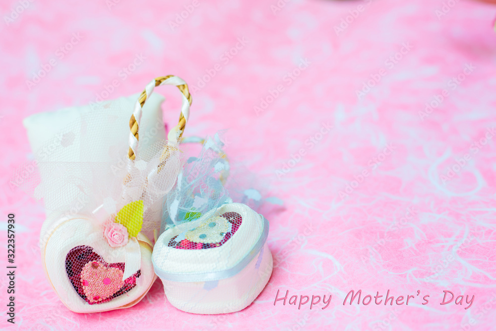 Happy Mother's day concepts. Mother's day and Sweetest day, love concept. White heart boxes with the letter Happy Mother's day on pink paper. copy space for text. Happy Mother's day concepts. Mother's day and Sweetest day, love concept. White heart boxes with the letter Happy Mother's day on pink paper. copy space for text.