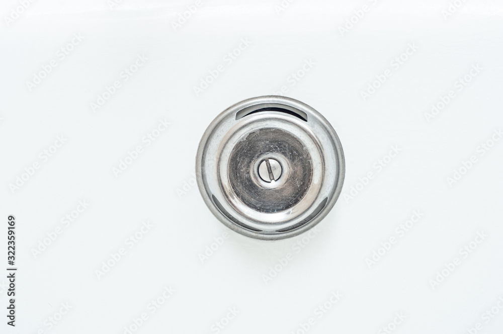 Clean shiny lid of the bathtub’s tap hole. Clean shiny lid of the bathtub’s tap hole.