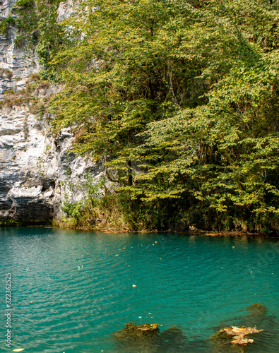 Unique blue mountain lake of the Caucasus located in a gorge with clear water and a depth of more than 100 meters