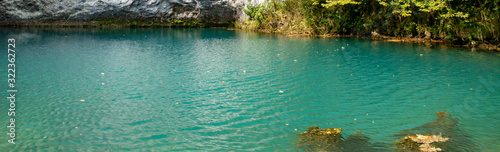 Unique blue mountain lake of the Caucasus located in a gorge with clear water and a depth of more than 100 meters