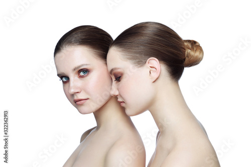 Portrait of two young beautiful girls with smoky eye makeup