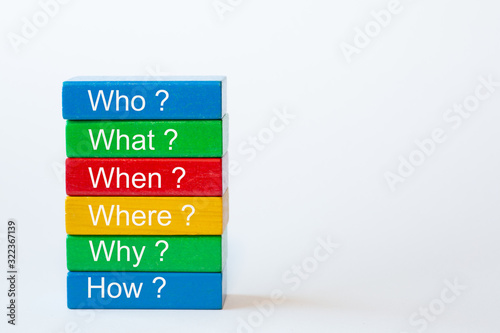 The words: Who, What, When, Where, Why and How are written on colorful blocks photo