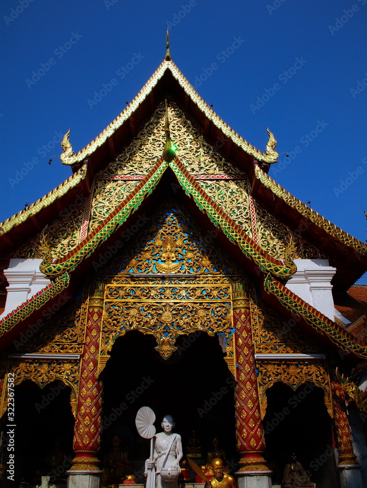 Naklejka premium Beautifully decorated facade of Wat Phrathat Doi Southep in Chiangmai Thailand with many Buddha Statues