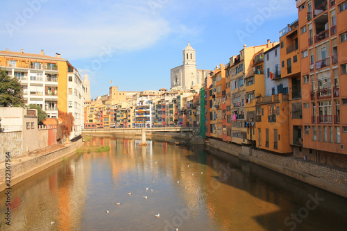 The amazing colorful houses along the river Onyar and the Cathedral of Saint Mary in the gorgeous city of Girona, Catalonia, Spain. © Picturereflex